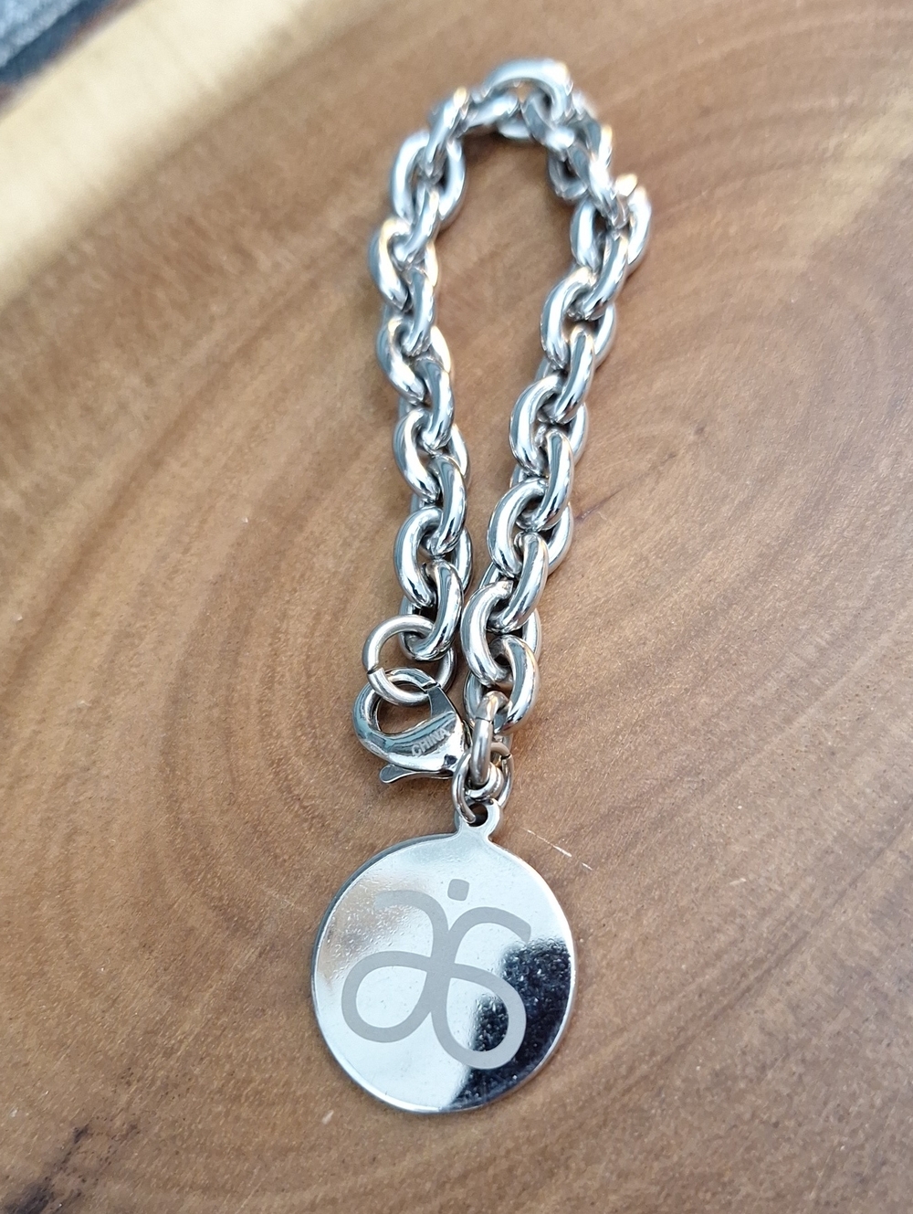 #ZZZ--03 Arbonne Silvertone Logo Charm Chain Bracelet
